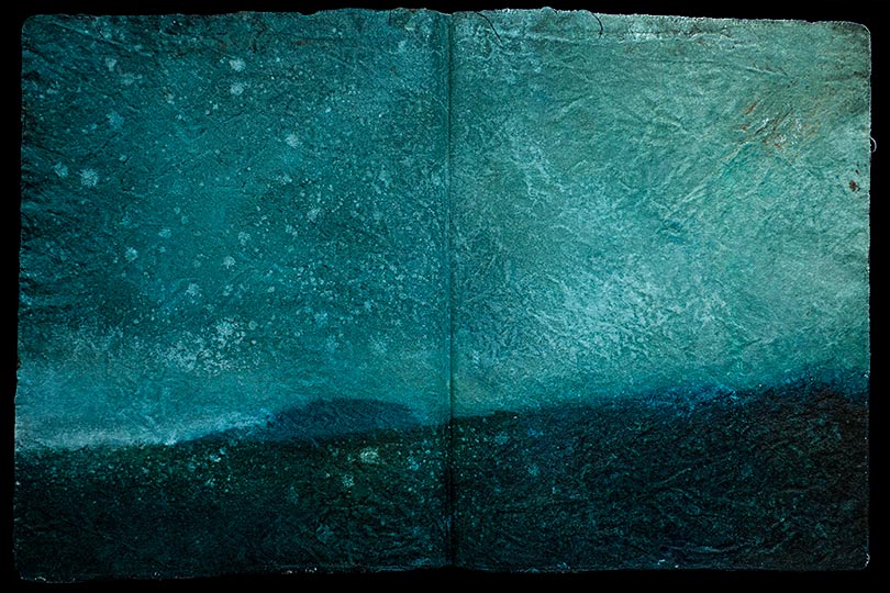 Painting of a blue-ish landscpe, in the form of an ancient book.