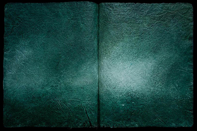 Painting of a green-ish landscpe, in the form of an ancient book.