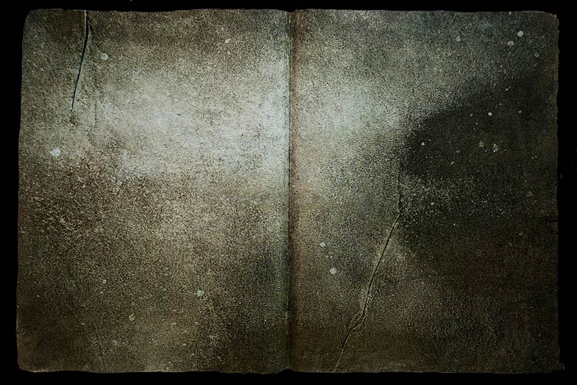 Sepia painting of a suggestion of a misty pond in the form of an ancient book.