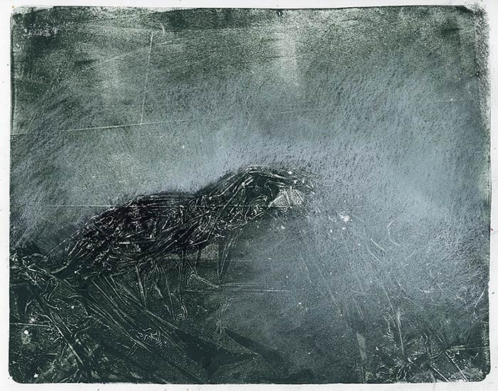 Drawing on a print; it looks like a snow storm on a mountain.